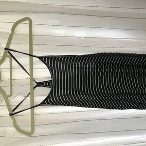 Black and white upper thigh-length tank top